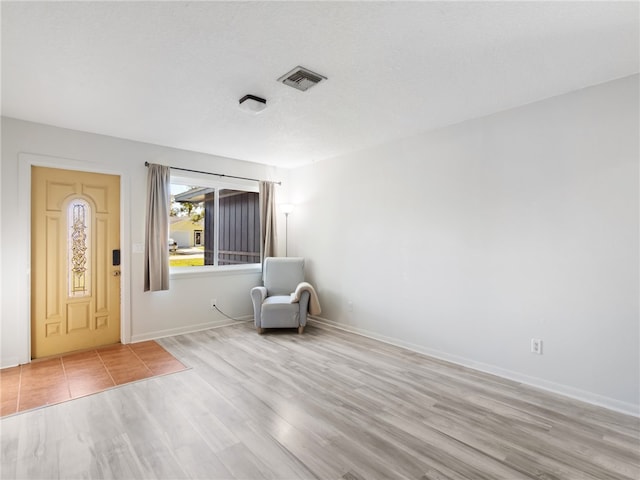 unfurnished room featuring light hardwood / wood-style floors