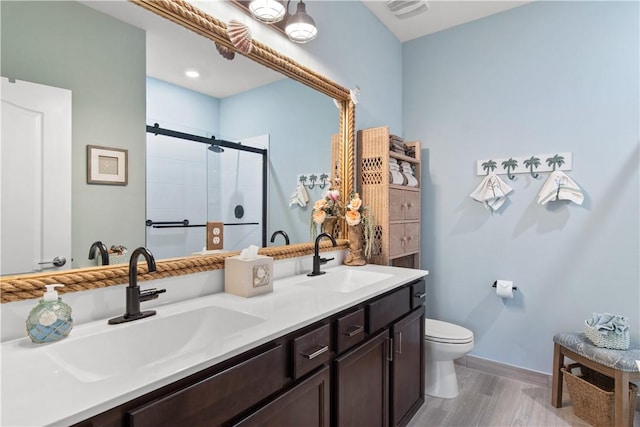 10095 W Villa Cir, Vero Beach, FL 32966 - bathroom with baseboards, visible vents, a shower stall, and a sink