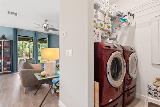 10095 W Villa Cir, Vero Beach, FL 32966 - washroom with ceiling fan, laundry area, visible vents, baseboards, and separate washer and dryer