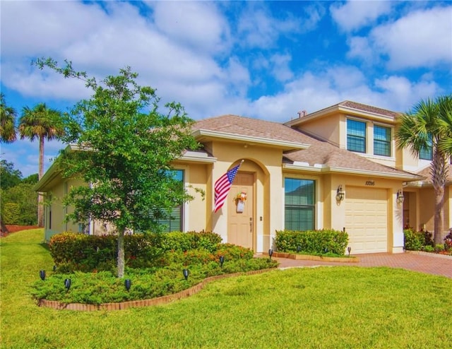 10095 W Villa Cir, Vero Beach, FL 32966 - mediterranean / spanish-style home with a garage, stucco siding, a front lawn, and decorative driveway