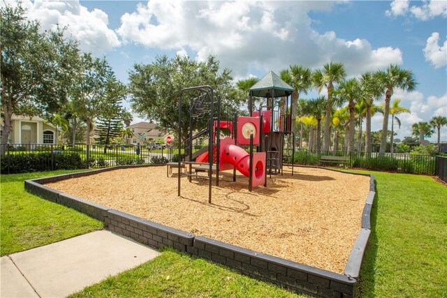 10095 W Villa Cir, Vero Beach, FL 32966 - community jungle gym with a lawn and fence