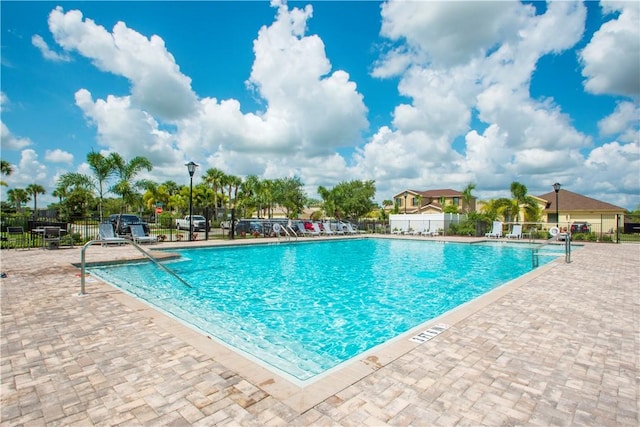 10095 W Villa Cir, Vero Beach, FL 32966 - community pool featuring fence and a patio