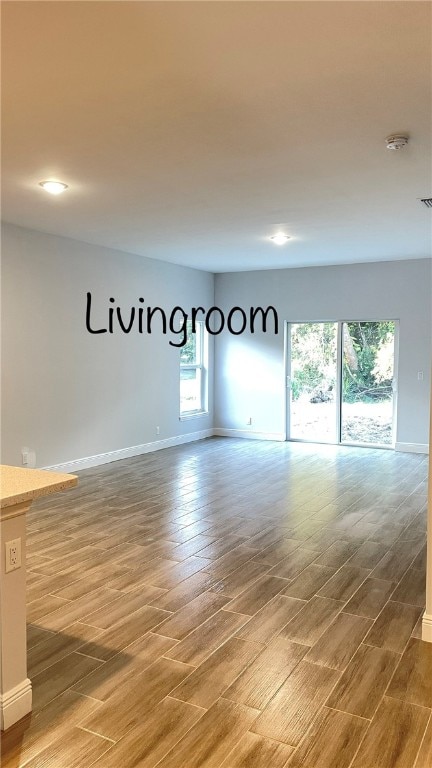 unfurnished room featuring hardwood / wood-style flooring