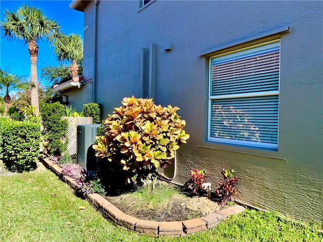 view of side of home with cooling unit