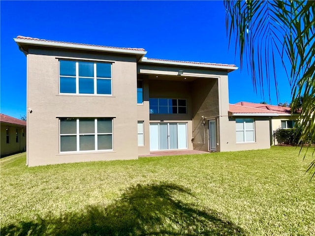 rear view of house with a lawn