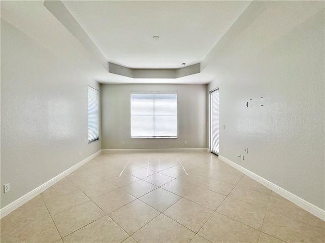 unfurnished room featuring light tile patterned floors