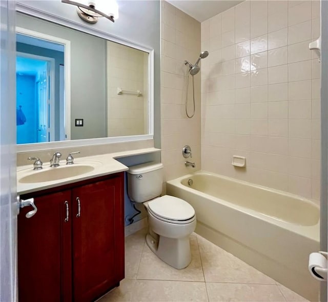 full bathroom with tile patterned floors, tiled shower / bath combo, toilet, and vanity