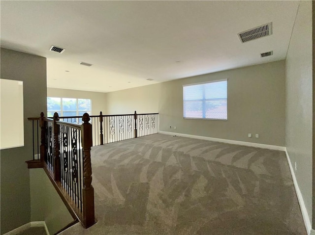 empty room with carpet flooring