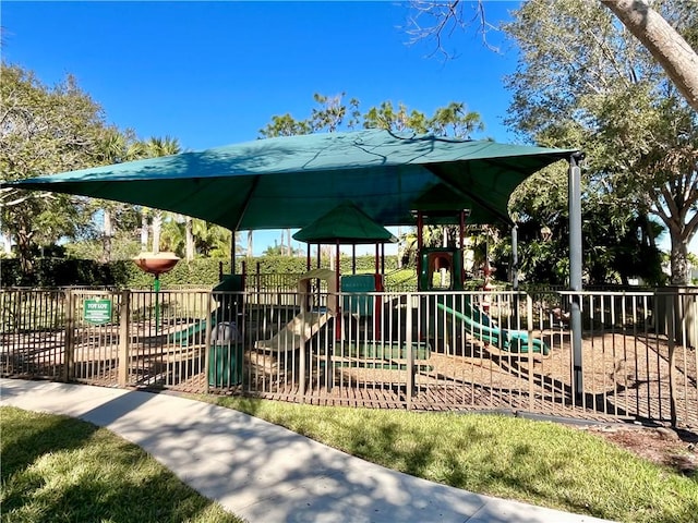 view of property's community with a playground