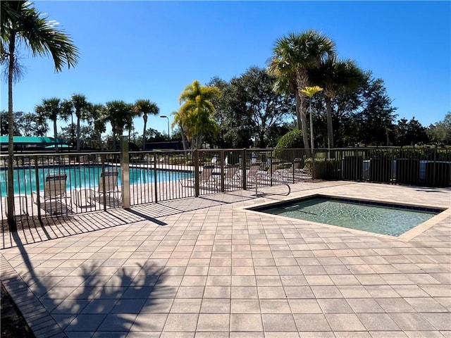 view of swimming pool with a patio