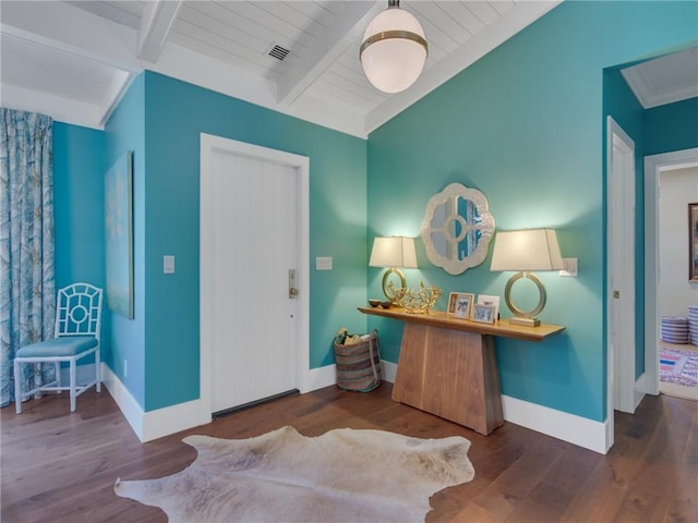 entryway with beam ceiling, wood ceiling, and dark wood-type flooring