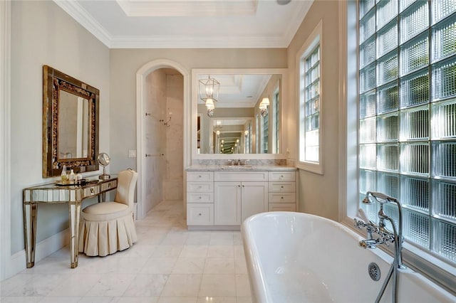 bathroom featuring a washtub, crown molding, a wealth of natural light, and vanity