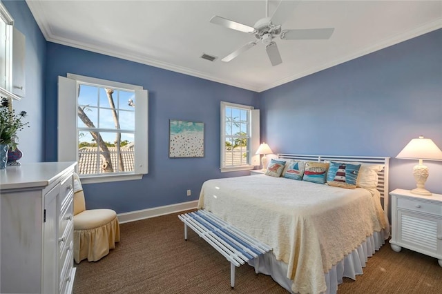 carpeted bedroom with ceiling fan, crown molding, and multiple windows