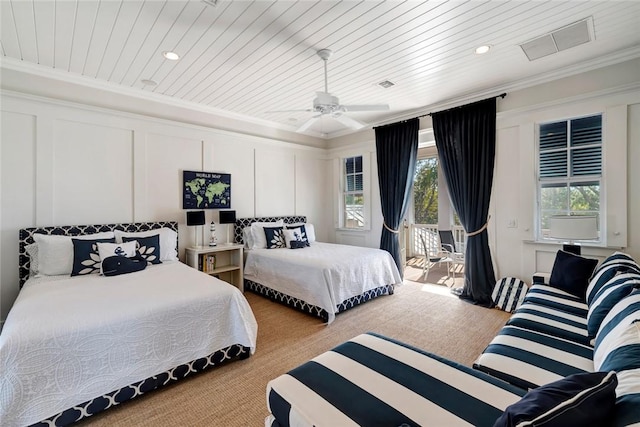 bedroom with ceiling fan, light colored carpet, wood ceiling, and crown molding