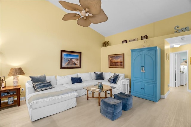 223 River Walk Unit 12, Hutchinson Island, FL 34949 - living area with a ceiling fan, light wood finished floors, and high vaulted ceiling