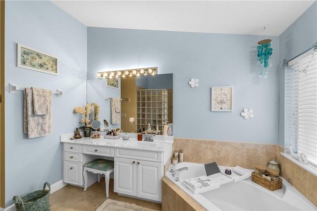223 River Walk Unit 12, Hutchinson Island, FL 34949 - full bath with vanity, a bath, and tile patterned floors