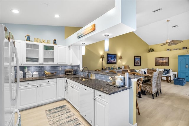 223 River Walk Unit 12, Hutchinson Island, FL 34949 - kitchen featuring white appliances, a peninsula, light wood-type flooring, open floor plan, and white cabinets