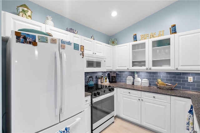 223 River Walk Unit 12, Hutchinson Island, FL 34949 - kitchen featuring white appliances, white cabinetry, glass insert cabinets, and recessed lighting