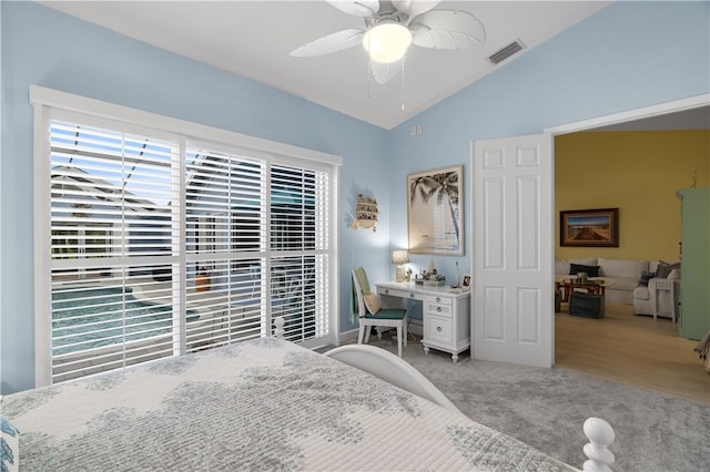 223 River Walk Unit 12, Hutchinson Island, FL 34949 - bedroom with vaulted ceiling, carpet flooring, and a ceiling fan