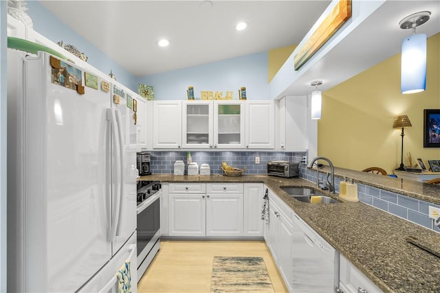 223 River Walk Unit 12, Hutchinson Island, FL 34949 - kitchen featuring white appliances, light wood-style floors, decorative backsplash, white cabinetry, and recessed lighting