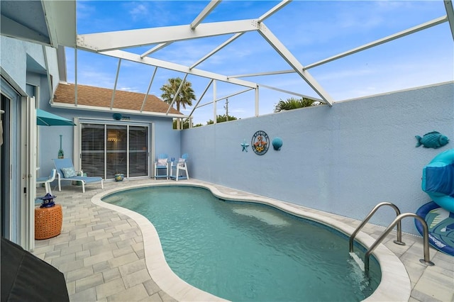 223 River Walk Unit 12, Hutchinson Island, FL 34949 - outdoor pool with a patio and glass enclosure