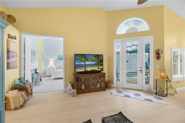 223 River Walk Unit 12, Hutchinson Island, FL 34949 - foyer featuring wood finished floors, high vaulted ceiling, french doors, and ceiling fan