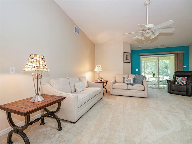 946 S Easy St, Sebastian, FL 32958 - living room featuring vaulted ceiling, light colored carpet, and a ceiling fan