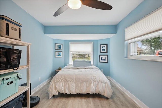 1933 Robalo Dr, Vero Beach, FL 32960 - bedroom featuring wood finished floors and a ceiling fan