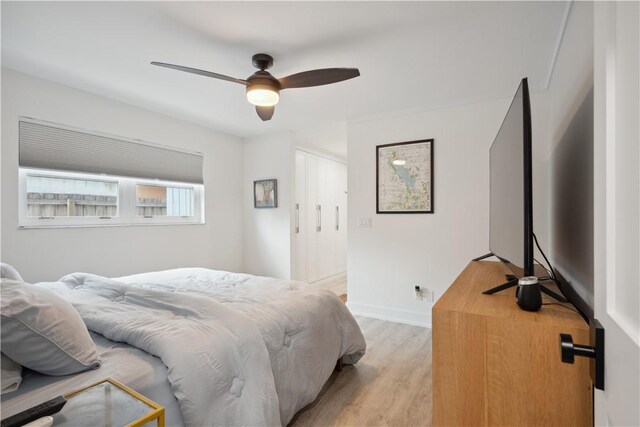 1933 Robalo Dr, Vero Beach, FL 32960 - bedroom with light wood-style floors, a closet, and ceiling fan