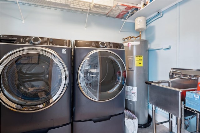 1933 Robalo Dr, Vero Beach, FL 32960 - washroom with water heater and washer and clothes dryer