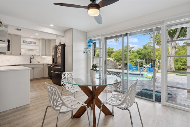 1933 Robalo Dr, Vero Beach, FL 32960 - dining space featuring ceiling fan, light wood finished floors, and recessed lighting