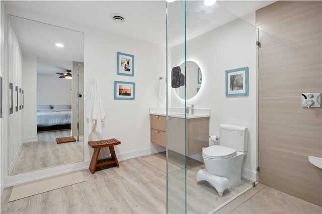 1933 Robalo Dr, Vero Beach, FL 32960 - ensuite bathroom with vanity, wood finished floors, and a ceiling fan
