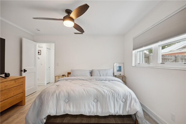 1933 Robalo Dr, Vero Beach, FL 32960 - bedroom with light wood-style flooring and a ceiling fan