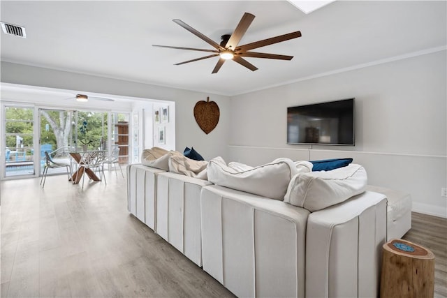 1933 Robalo Dr, Vero Beach, FL 32960 - living room featuring a ceiling fan and wood finished floors