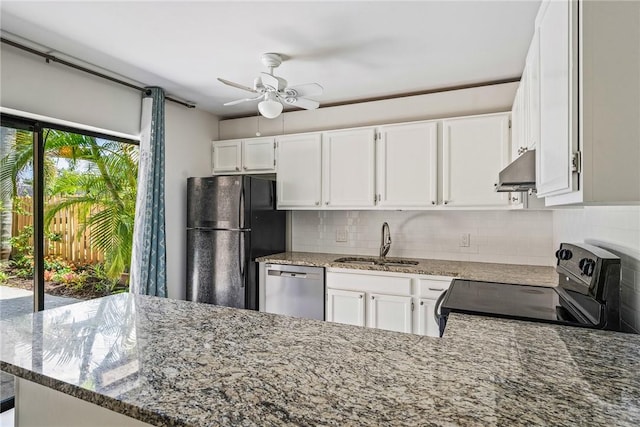 415 E Waverly Pl Unit 1C, Vero Beach, FL 32960 - kitchen with under cabinet range hood, a sink, black appliances, tasteful backsplash, and ceiling fan