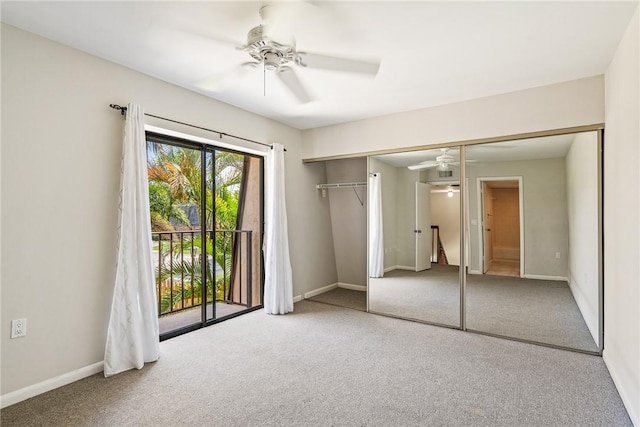 415 E Waverly Pl Unit 1C, Vero Beach, FL 32960 - unfurnished bedroom with a ceiling fan, carpet floors, a closet, and baseboards