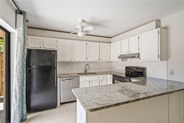 415 E Waverly Pl Unit 1C, Vero Beach, FL 32960 - kitchen with a sink, black appliances, a peninsula, under cabinet range hood, and light stone countertops