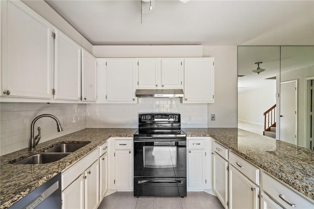 415 E Waverly Pl Unit 1C, Vero Beach, FL 32960 - kitchen with a sink, dark stone countertops, white cabinetry, black range with electric stovetop, and under cabinet range hood
