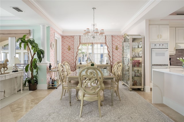 dining area with crown molding, baseboards, a chandelier, and visible vents