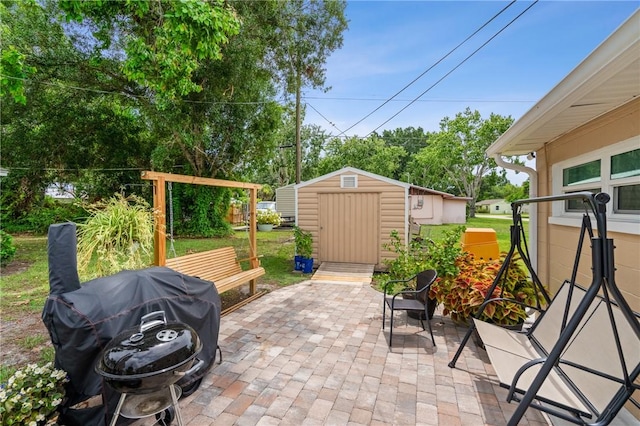 2106 36th Ave, Vero Beach, FL 32960 - view of patio featuring a storage shed and area for grilling