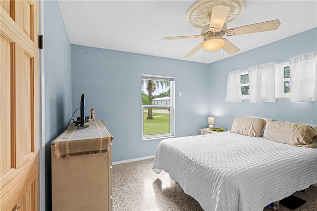 2106 36th Ave, Vero Beach, FL 32960 - bedroom with dark speckled floor and a ceiling fan