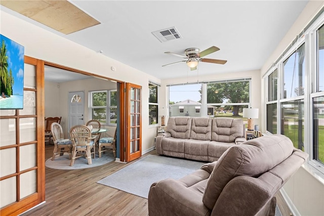 2106 36th Ave, Vero Beach, FL 32960 - living area featuring wood finished floors, plenty of natural light, and ceiling fan