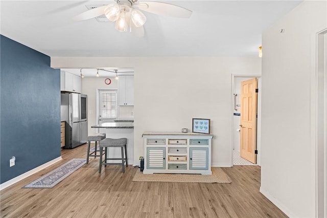 2106 36th Ave, Vero Beach, FL 32960 - living area featuring ceiling fan and light wood-style floors