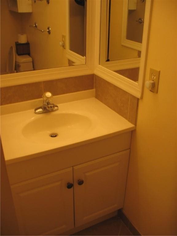 bathroom with vanity and toilet