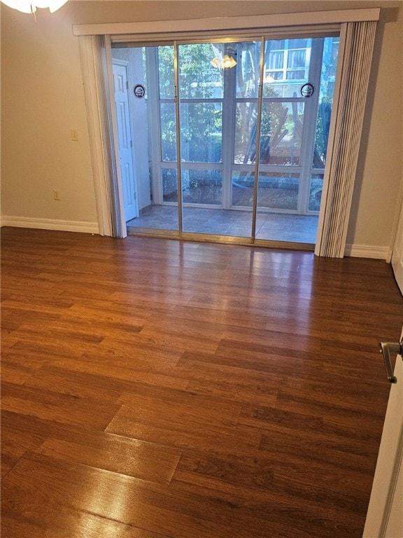 spare room featuring dark hardwood / wood-style floors