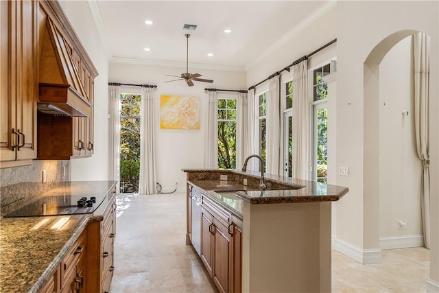 kitchen with tasteful backsplash, visible vents, ornamental molding, black electric cooktop, and a sink