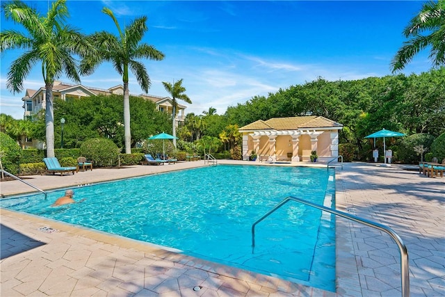 community pool with a patio area