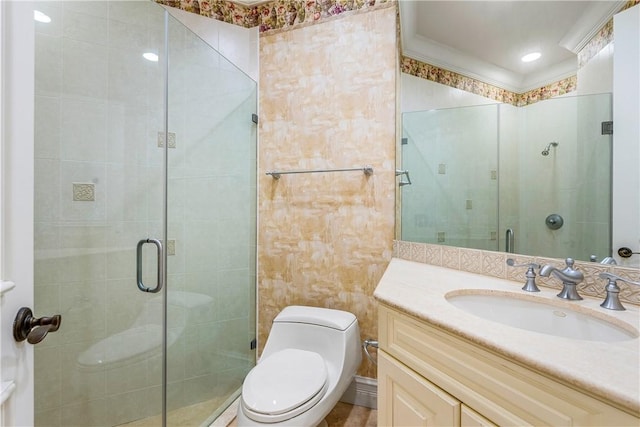 full bathroom with a shower stall, toilet, and vanity