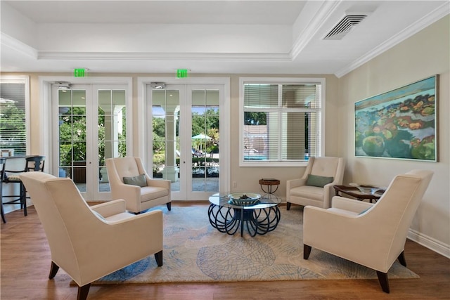 interior space featuring french doors, plenty of natural light, and visible vents