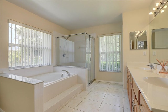full bathroom with a bath, plenty of natural light, a shower stall, and a sink